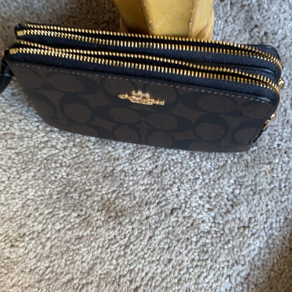 Women’s Coach wristlet not leather. New never been used. Nice